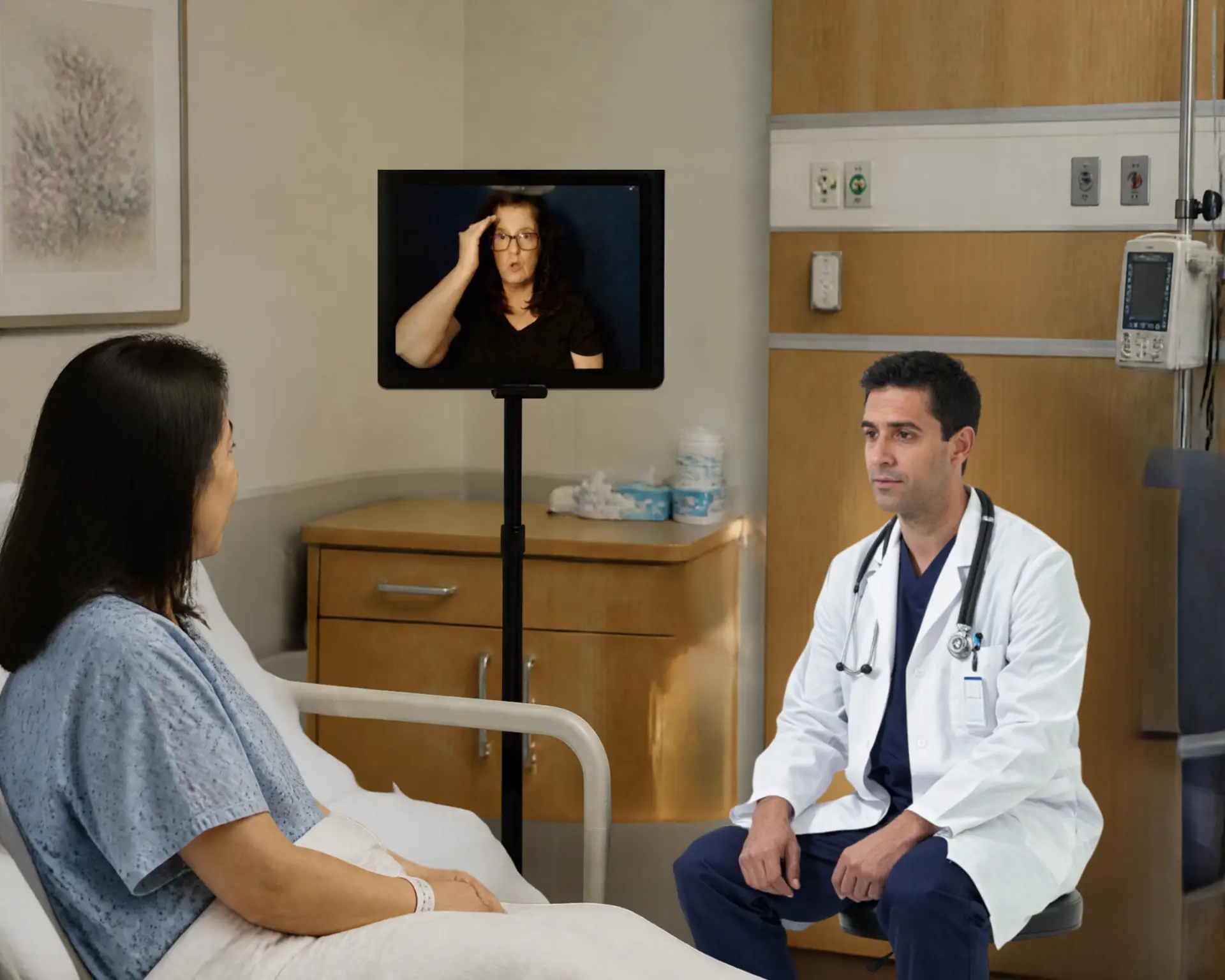 An ASL interpreter providing video remote interpreting in a hospital setting with a patient and doctor